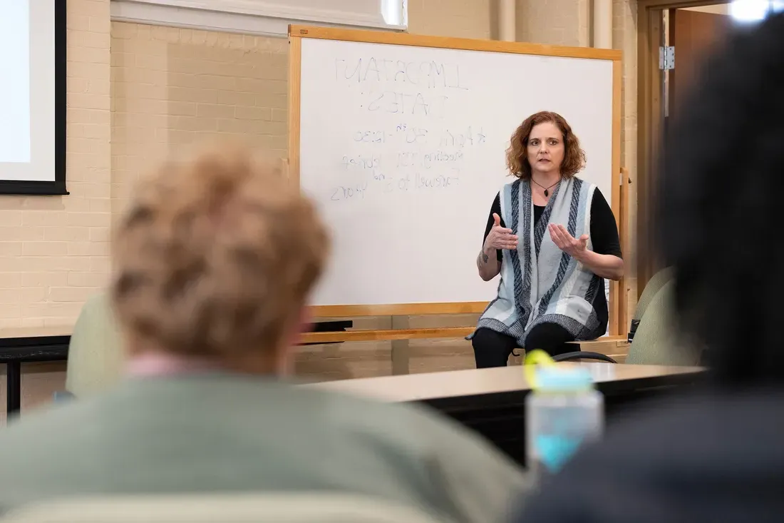 Marriage and family therapy professor Deb Coolhart G’01, G’06 in a discussion during the team’s monthly meeting in April.